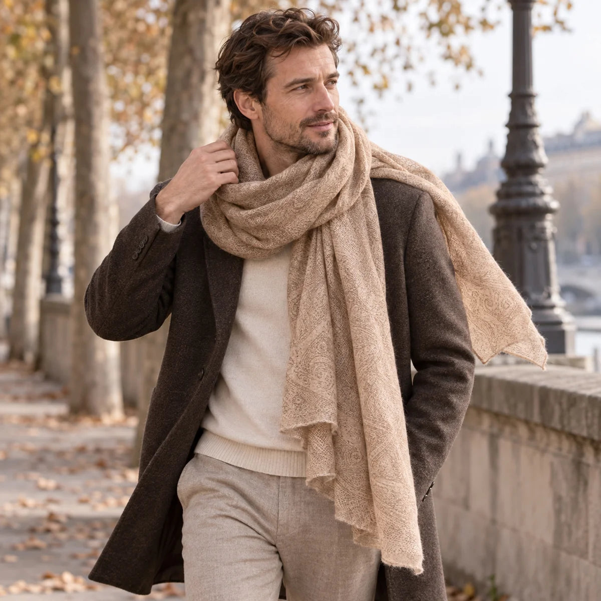 Man wearing camel open weave cashmere scarf with brown coat