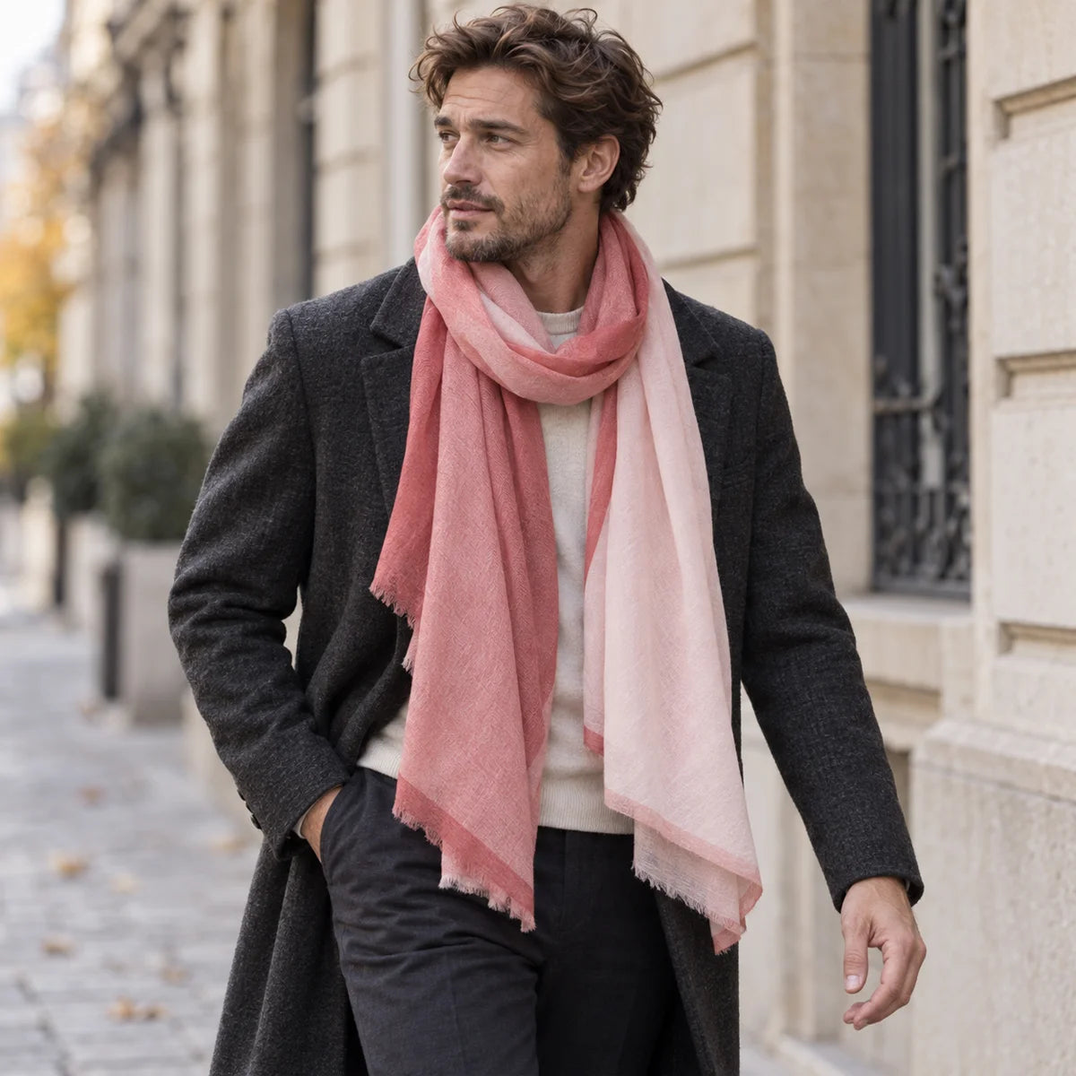 Man wearing rose paneled wool scarf with dark coat outdoors