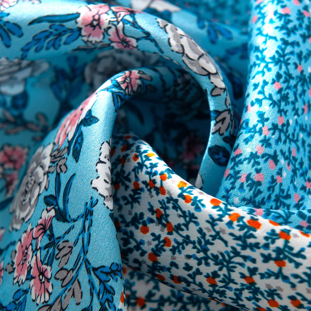 Mixed blue floral silk scarf fabric close-up