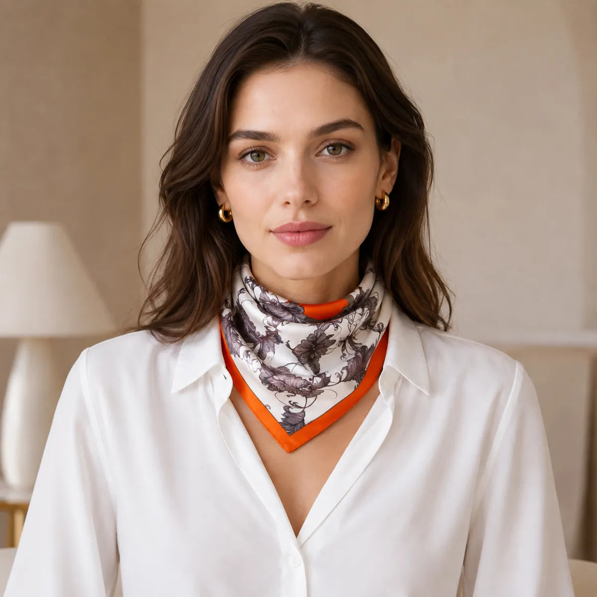 Model wearing triangle-folded silk scarf