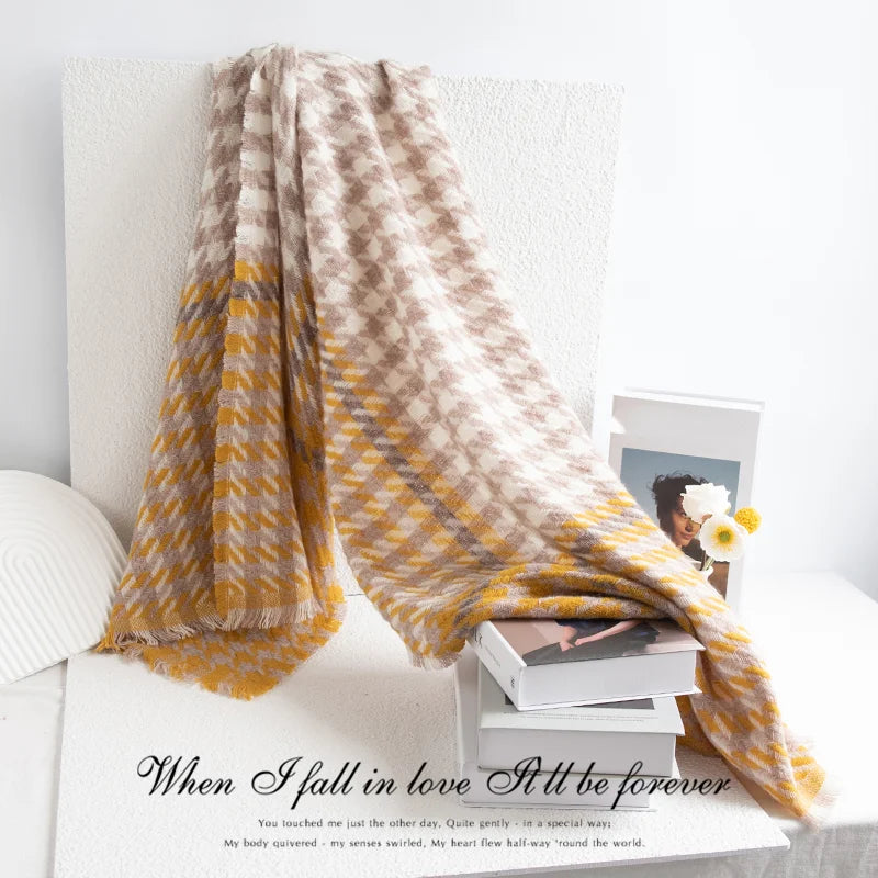 Mustard houndstooth scarf cascading across white display blocks