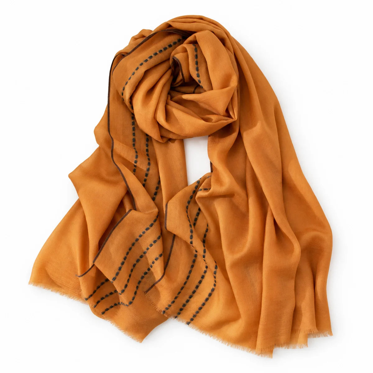 Mustard wool scarf loosely looped with contrasting stitched border visible