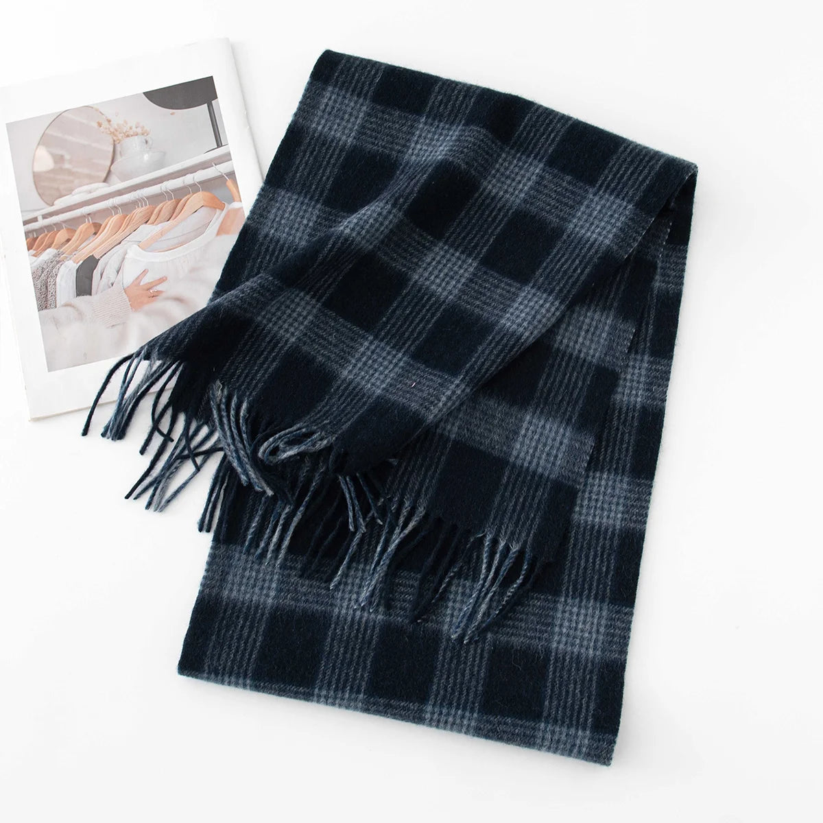 Navy blue microcheck wool scarf folded with dark fringe visible