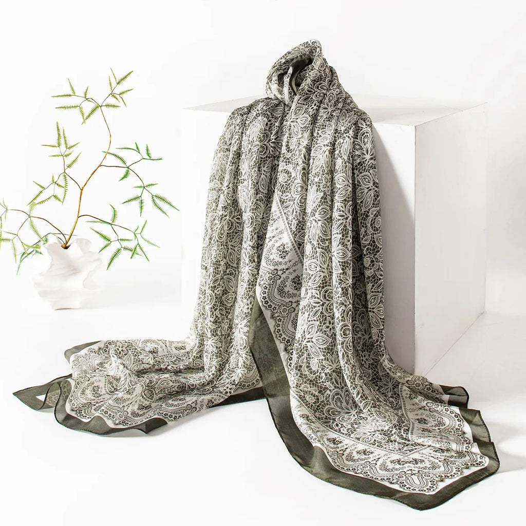 Olive botanical lace scarf on display stand