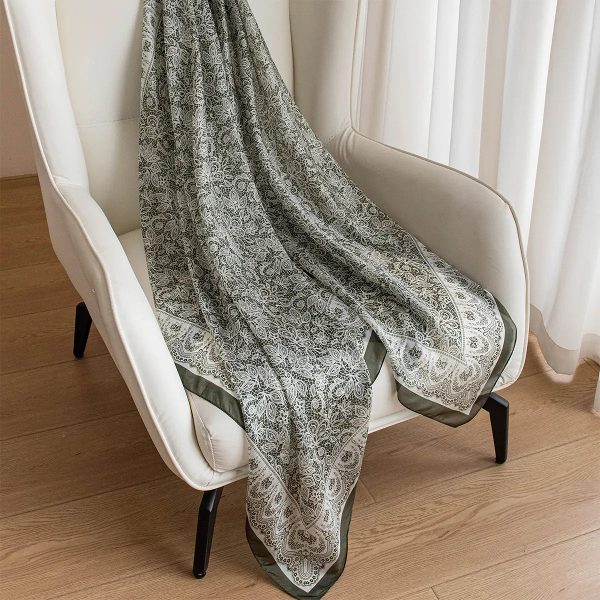 Olive botanical lace silk scarf on chair