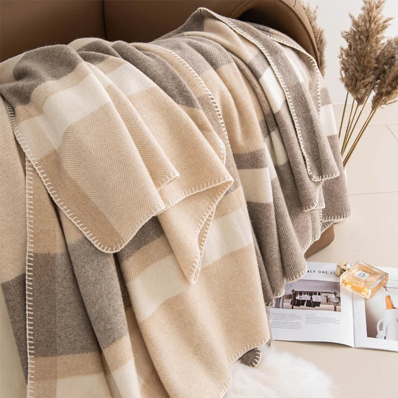 Oversized neutral checked wrap cascading over a chair back
