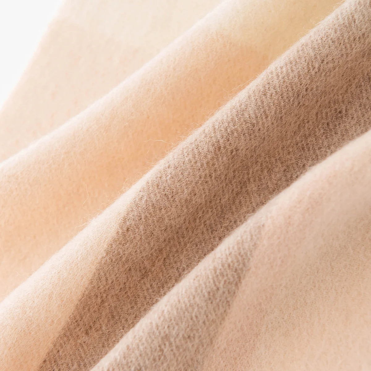 Pale cream and camel check sections in diagonal folds