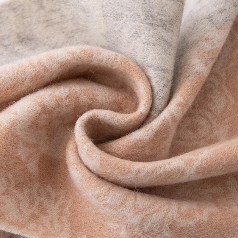 Peach gray floral fabric gathered into a soft swirl