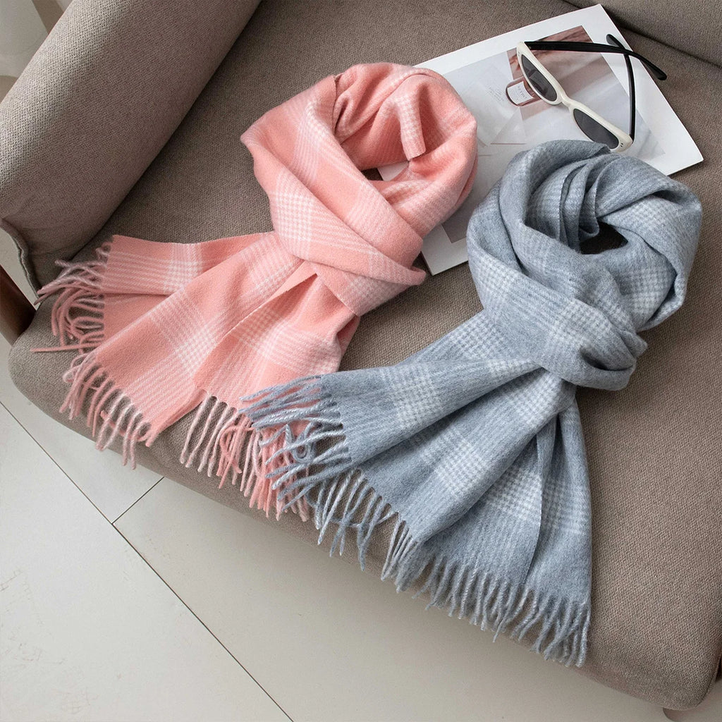 Pink and blue gray wool scarves knotted on a chair