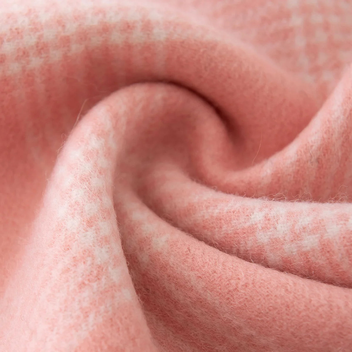 Pink microcheck fabric gathered into a softly textured swirl