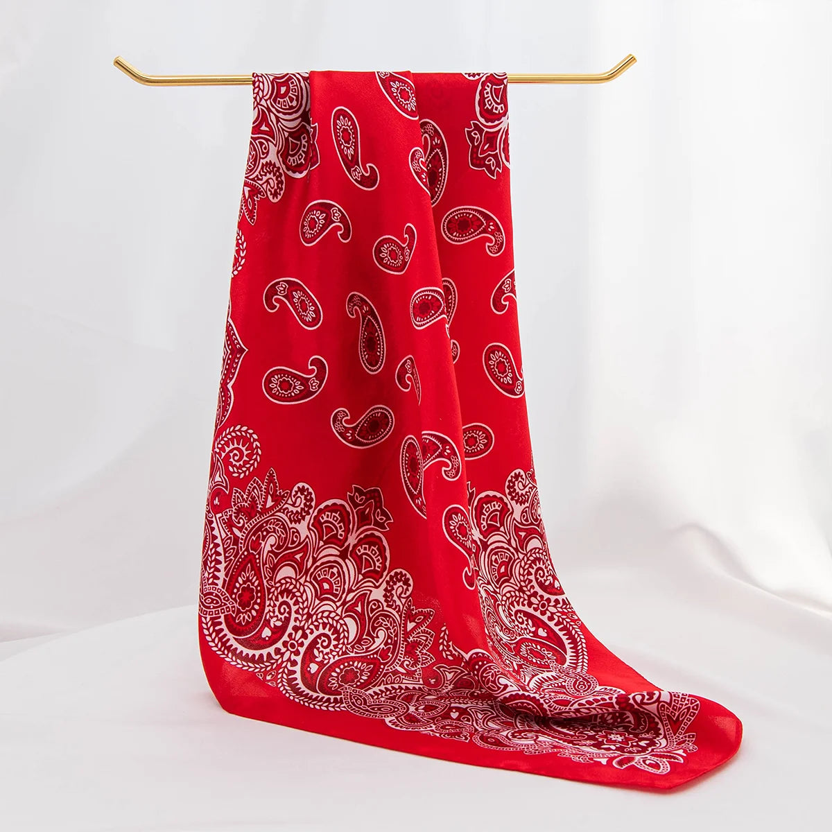 Red paisley silk scarf draped display