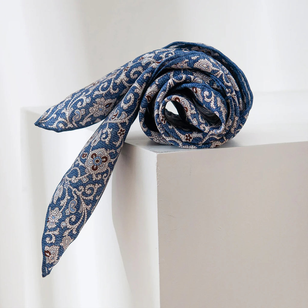 Rolled blue ditsy floral Silk Square Scarf display