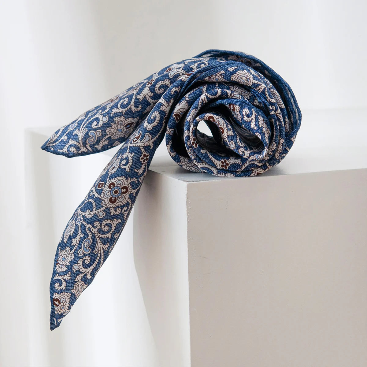 Rolled blue ditsy floral Silk Square Scarf display