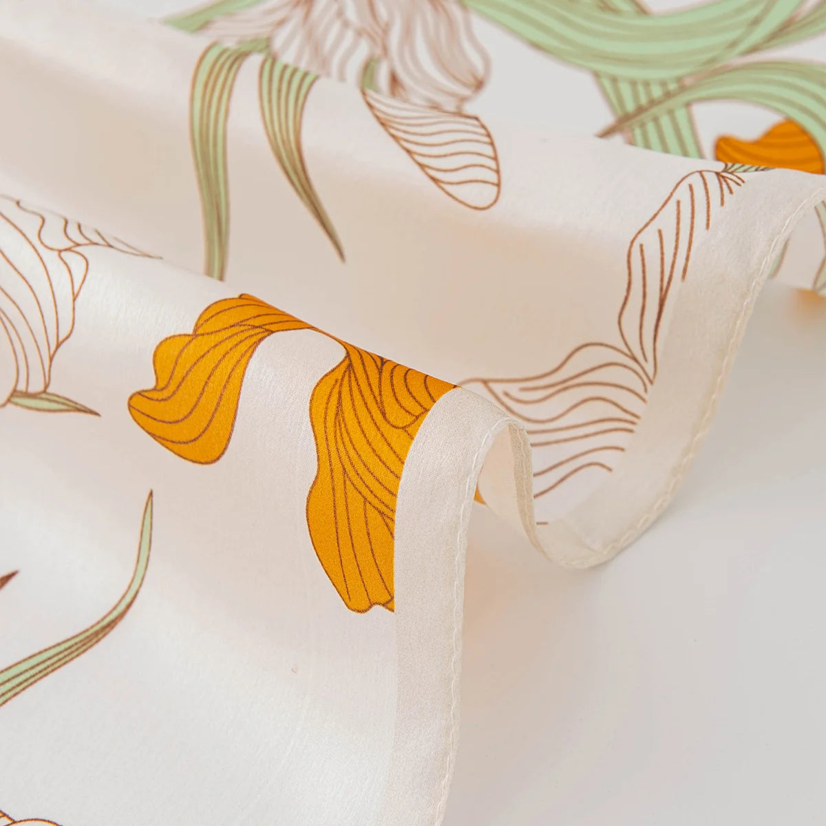 Rolled edge detail of botanical Silk Square Scarf