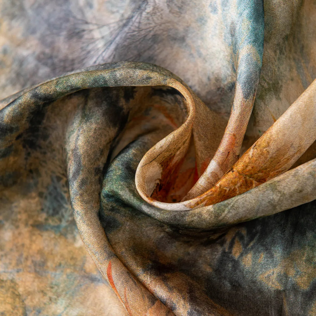 Rolled emerald botanical silk scarf close-up