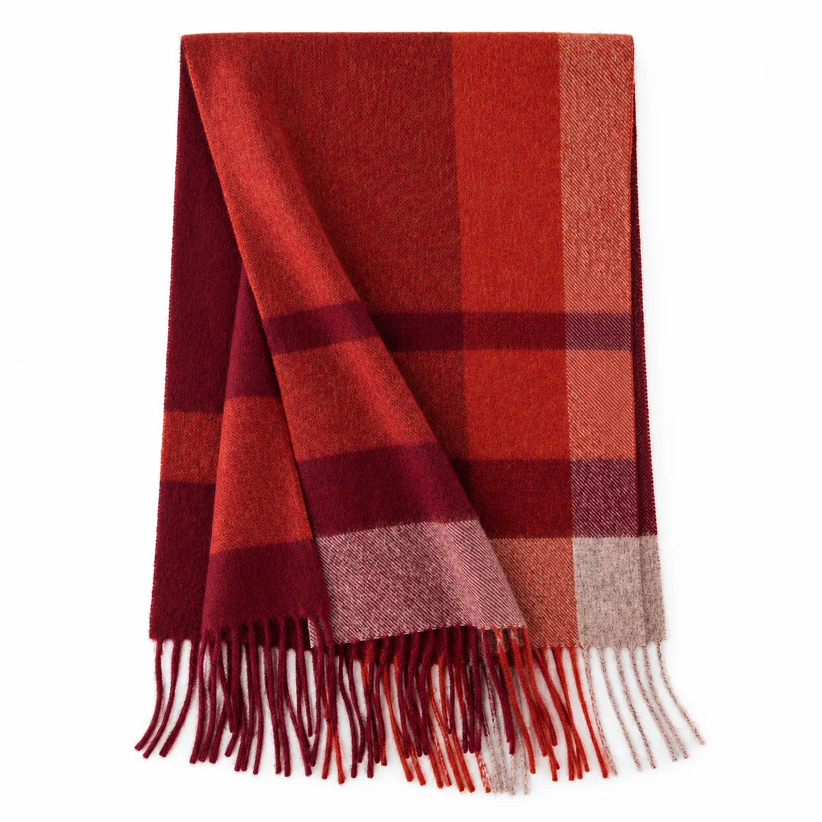 Rust and burgundy checked wool scarf beside a cream handbag