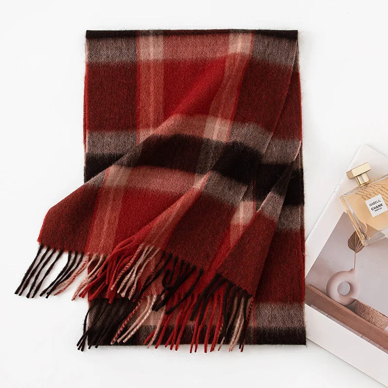Rust black plaid cashmere scarf folded with dark fringe