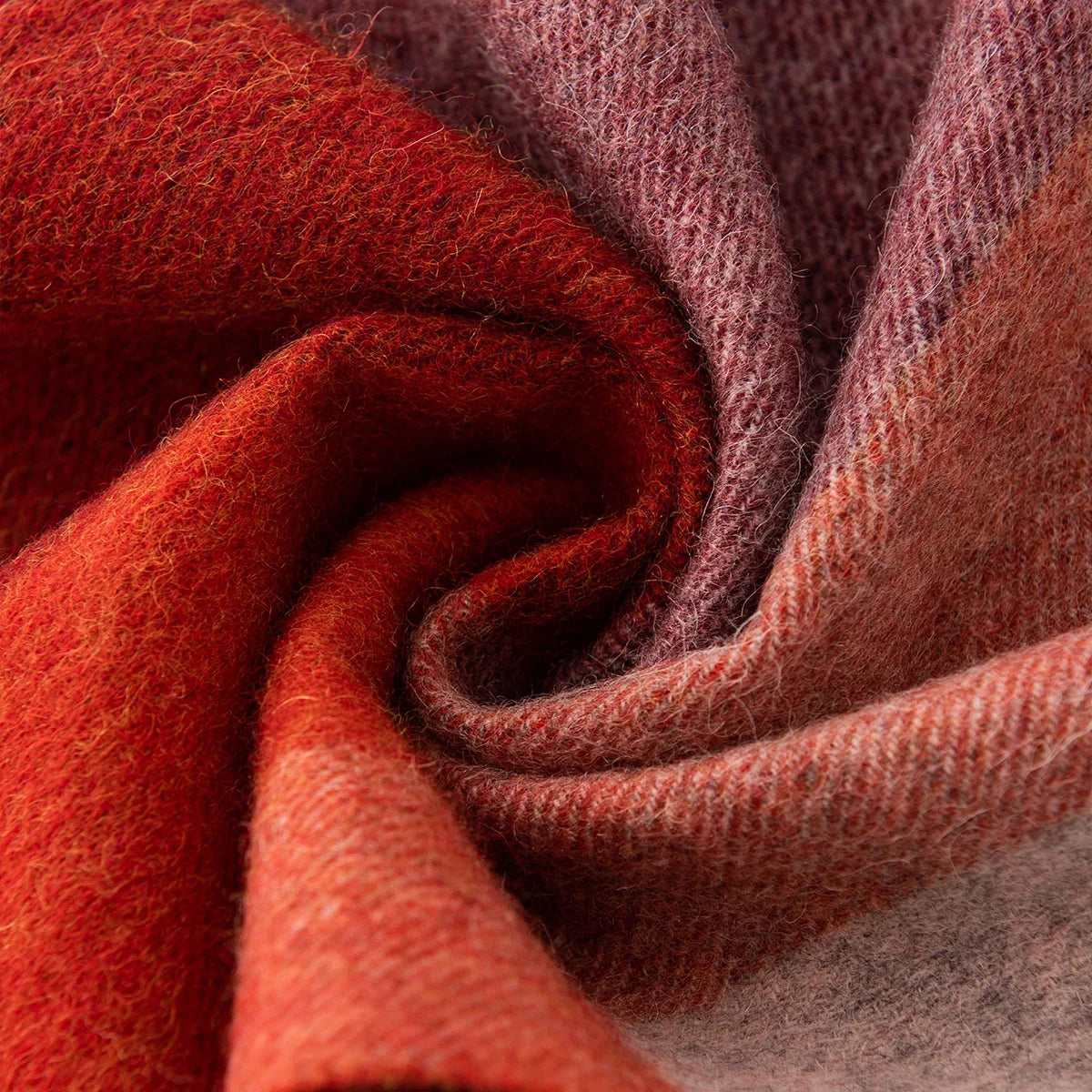 Rust burgundy and rose fabric gathered into a swirl