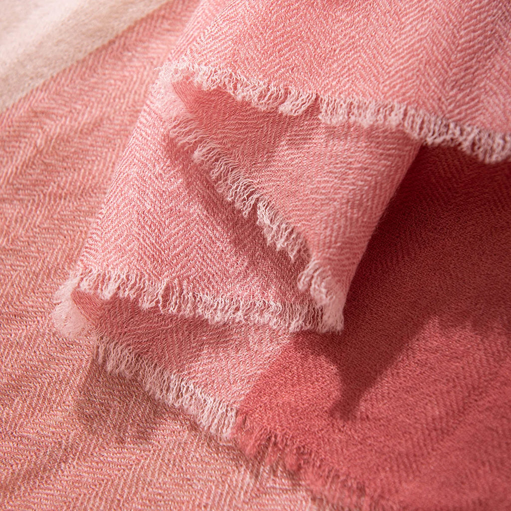 Short wispy fringe along pink and rose fabric edges