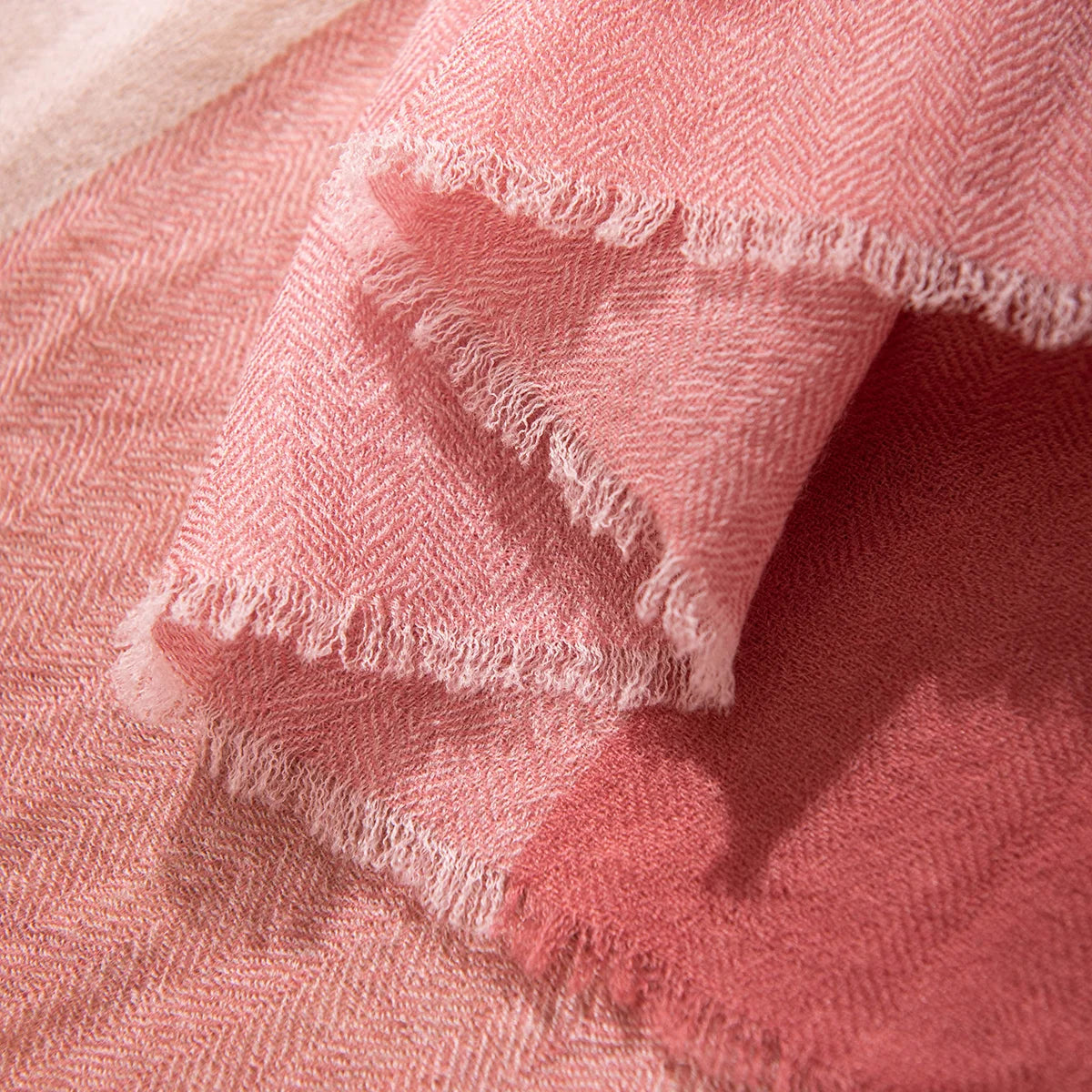 Short wispy fringe along pink and rose fabric edges