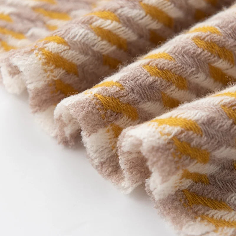 Short mustard and cream fringe along textured scarf edge