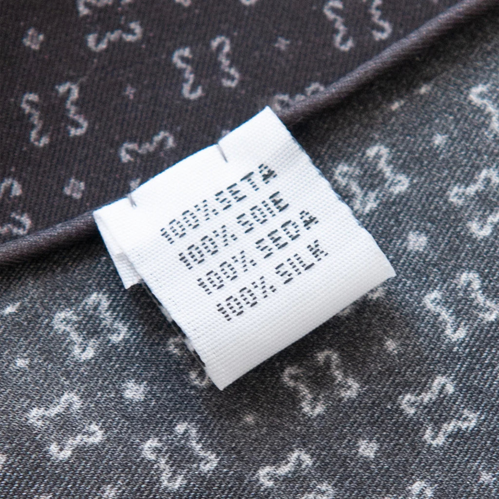 Silk Square Scarf care label with black pattern