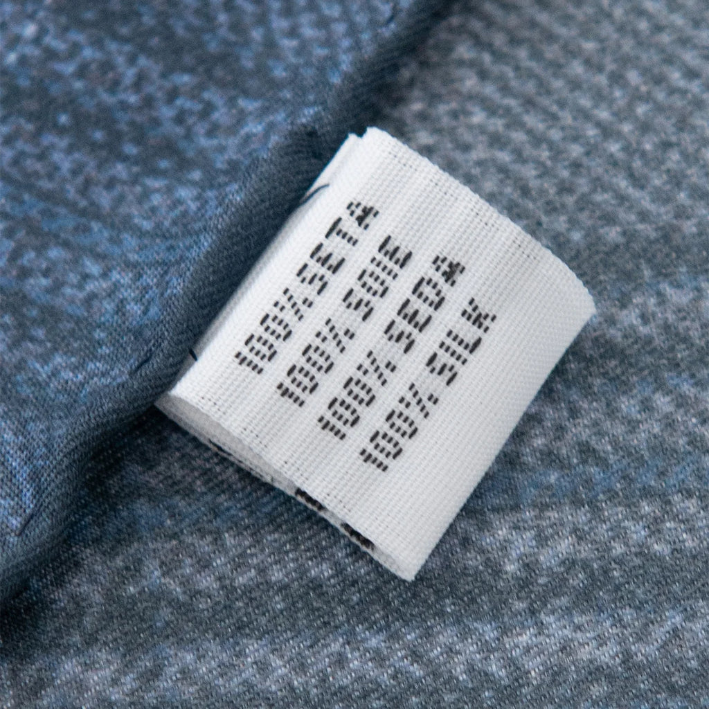 Silk Square Scarf fabric label close-up on blue plaid