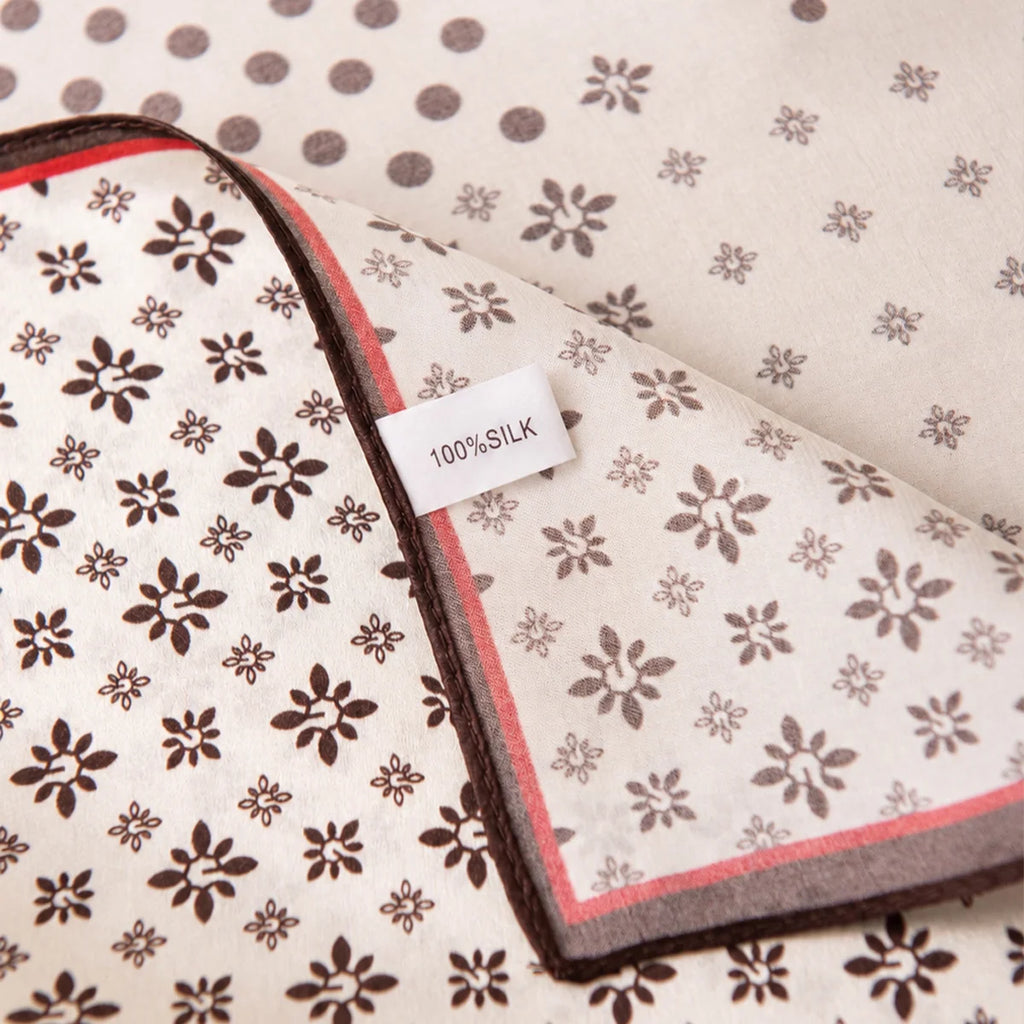Silk Square Scarf label beside scattered floral motifs