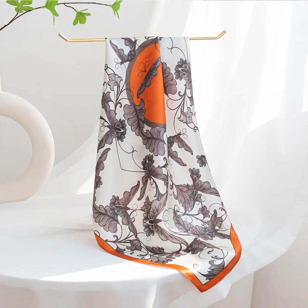 Silk scarf draped on a gold rack