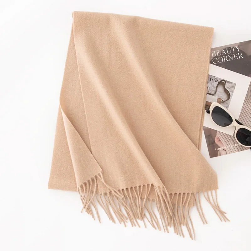 Solid camel fringed scarf displayed on white background