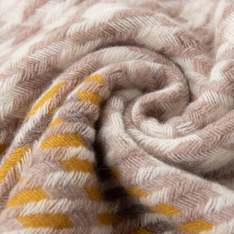 Taupe and mustard yarns gathered into a fabric swirl