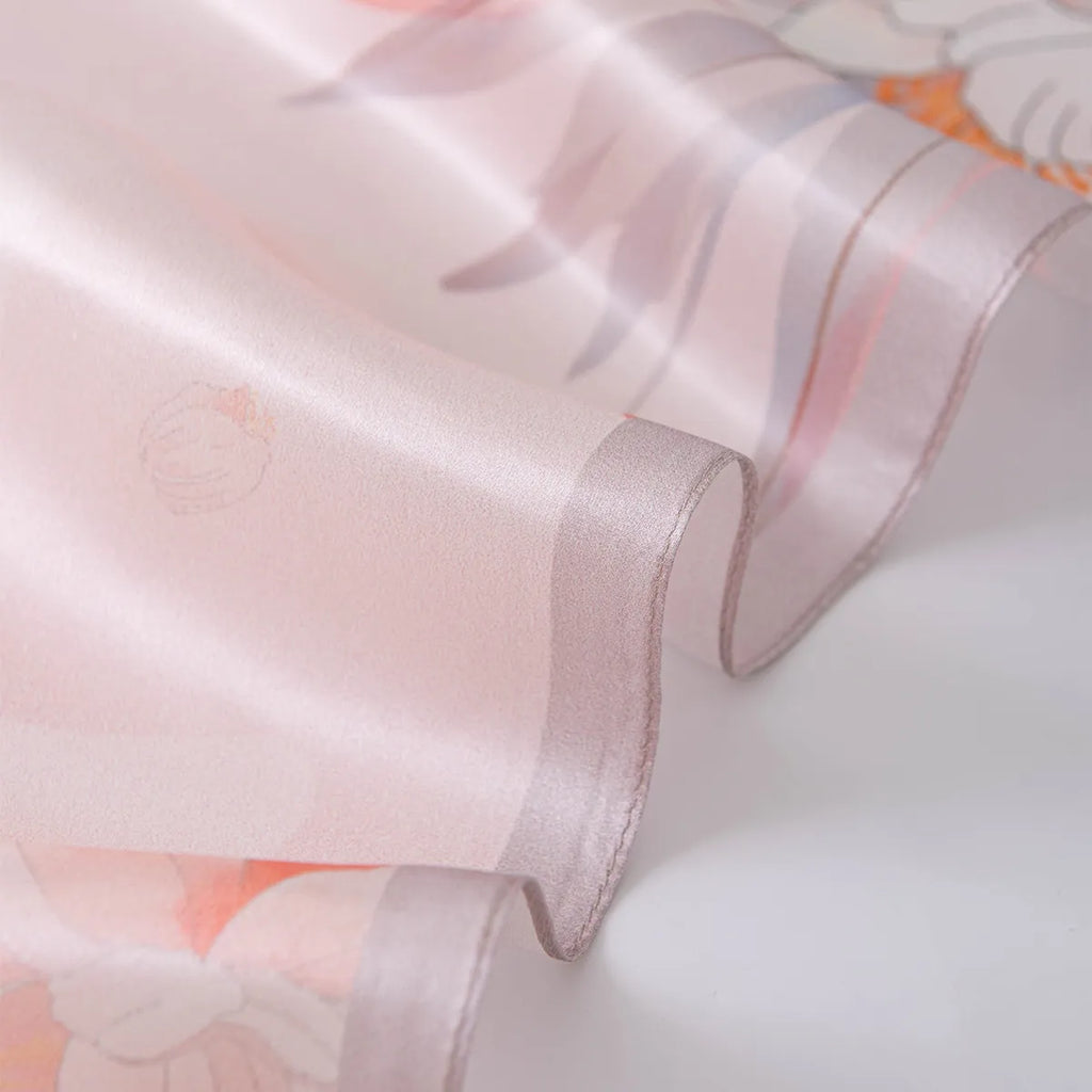 Wavy pale pink rolled edge on a light pink silk scarf