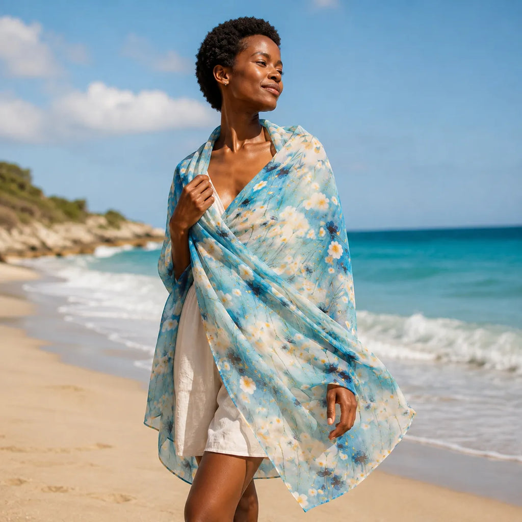 Woman styling aqua silk scarf at beach