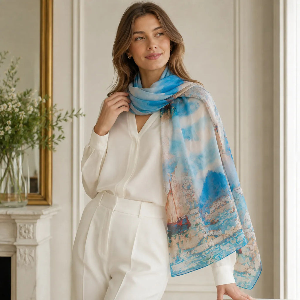 Woman styling azure sailboat silk scarf indoors