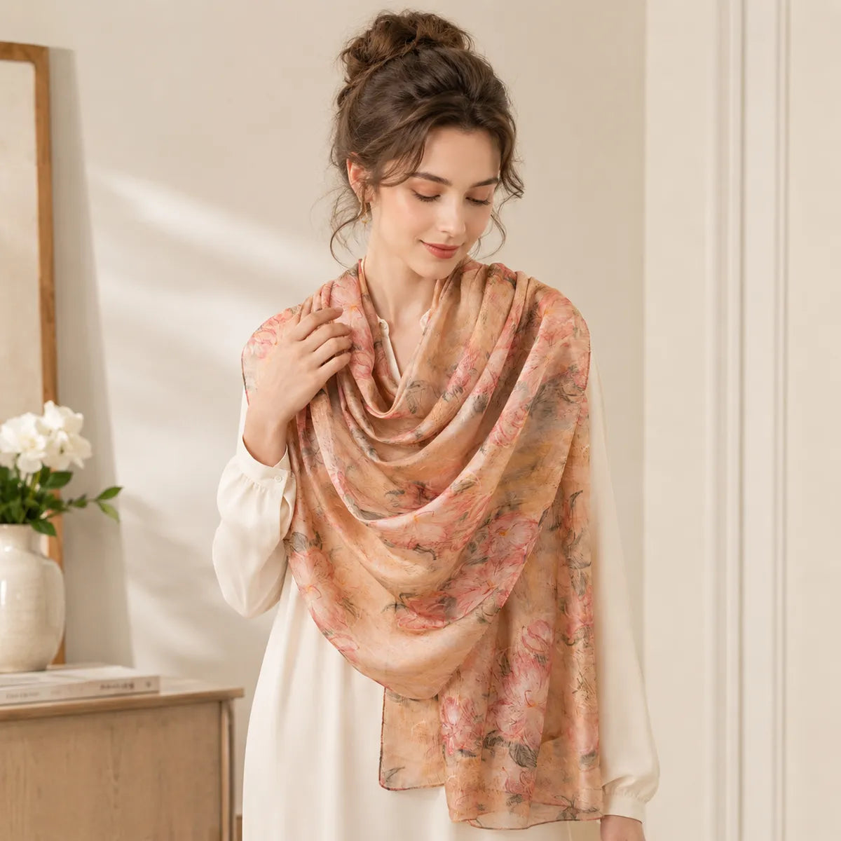 Woman wearing blush cherry blossom silk shawl indoors