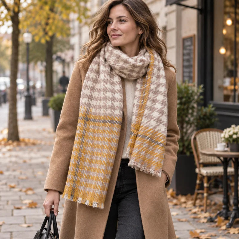 Woman wearing mustard houndstooth wool scarf with camel coat