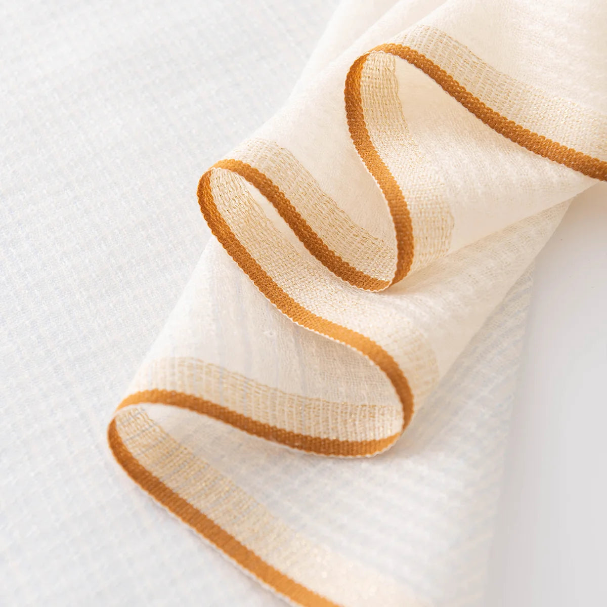 cream blue scarf gold trim detail