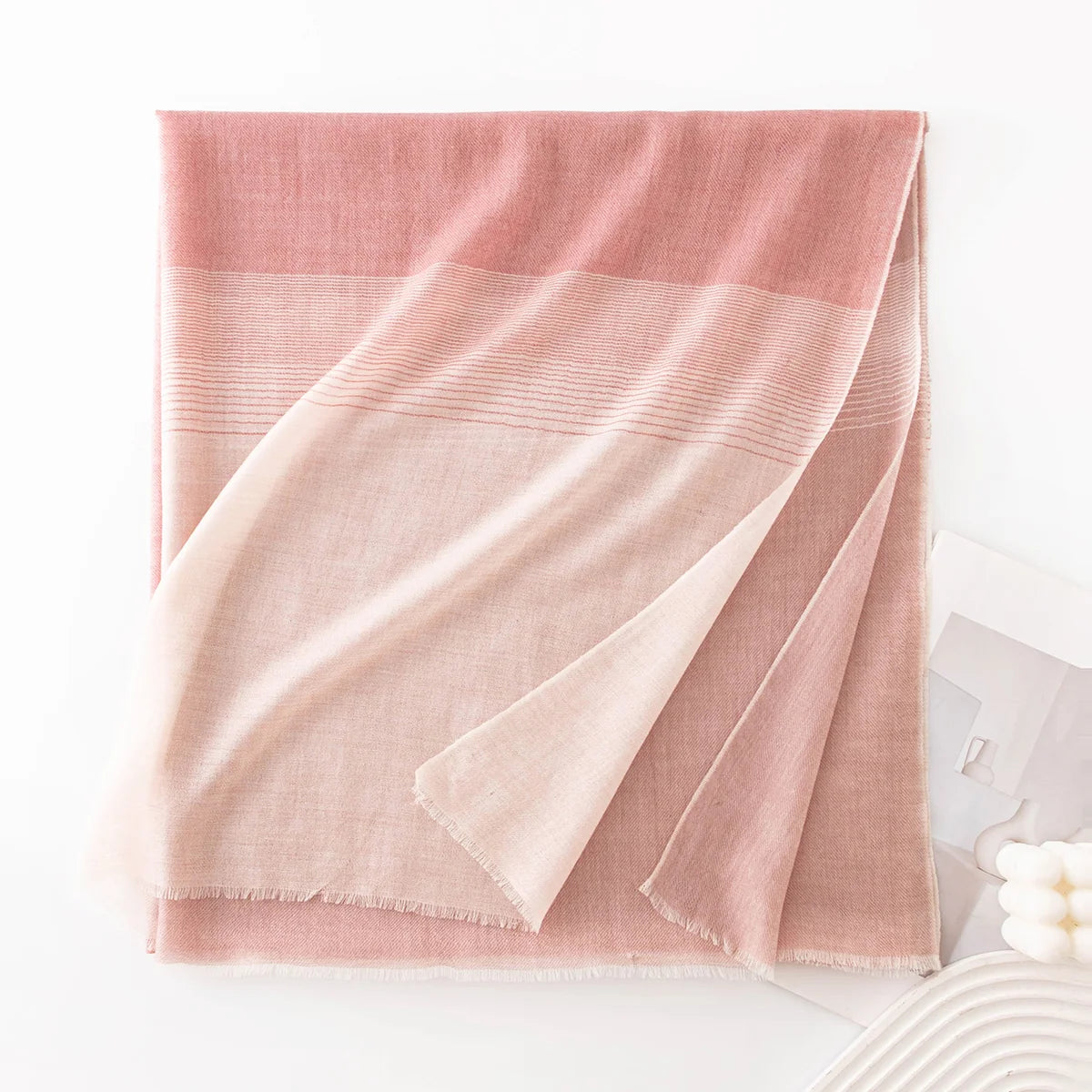 pink striped scarf folded
