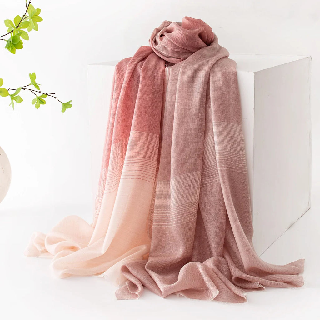 pink striped scarf on display stand